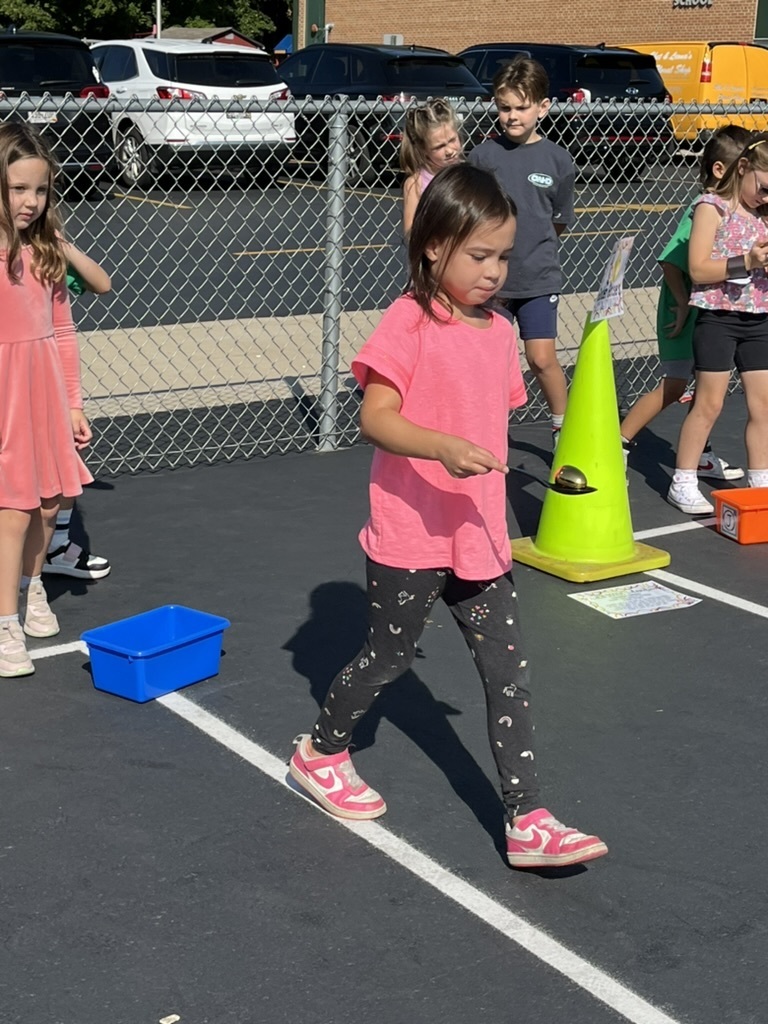 Student walking in golden egg race