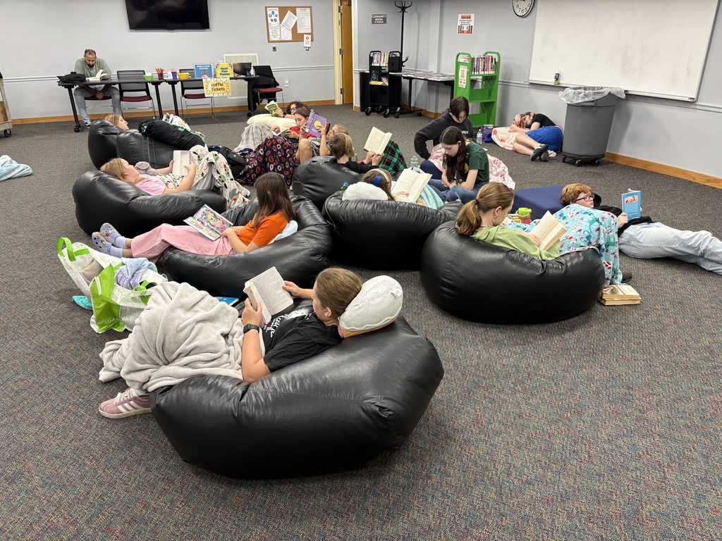 Reading Rampage students sitting in beanbag chairs reading.