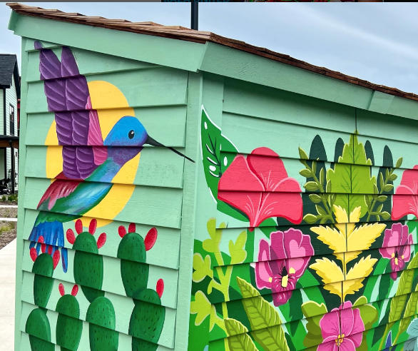 Mural on a garden shed with various flowers.
