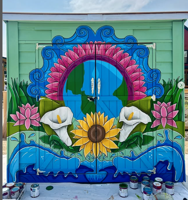 Mural on a garden shed with various flowers.