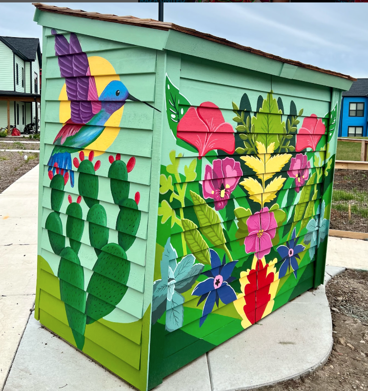 Mural on a garden shed with various flowers.