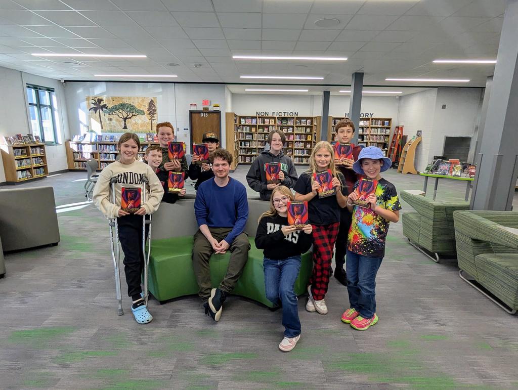 Struan Murray posing with students .