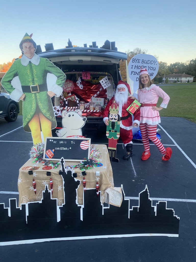 Scene from Elf movie as decorated trunk or treat car