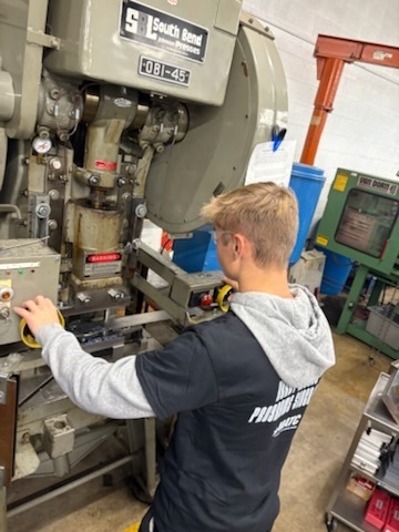 Students trying engine press