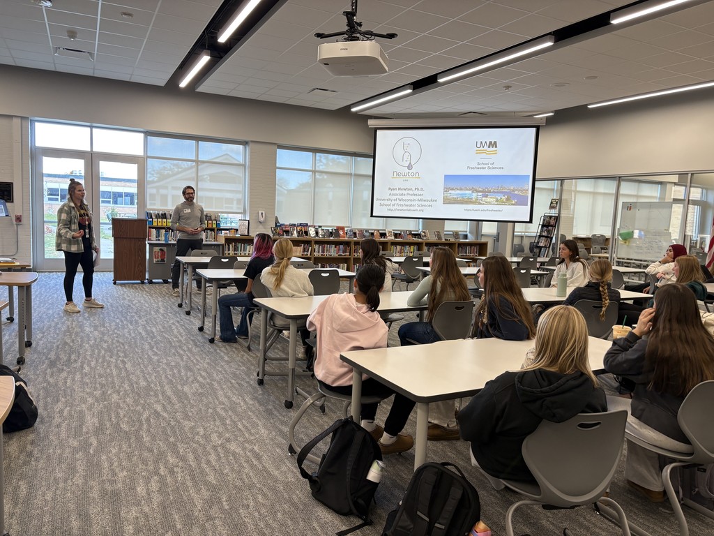 Students listening t a Freshwater Sciences presentation in the library.