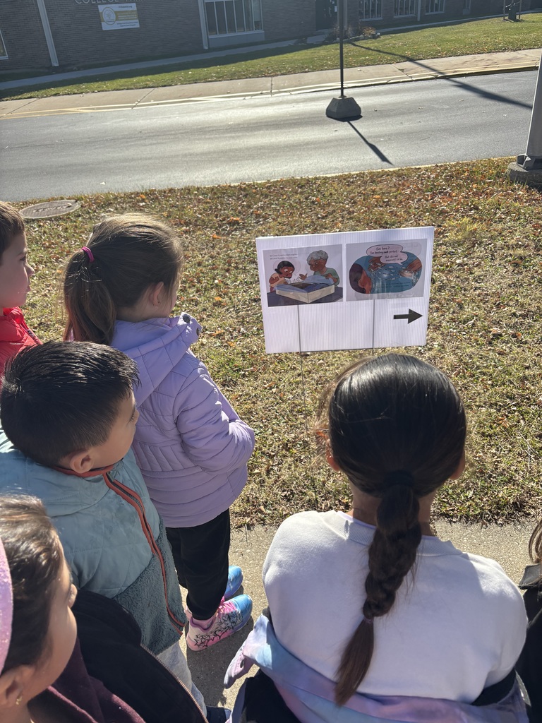 Students looking at 2025 Storywalk at College Park