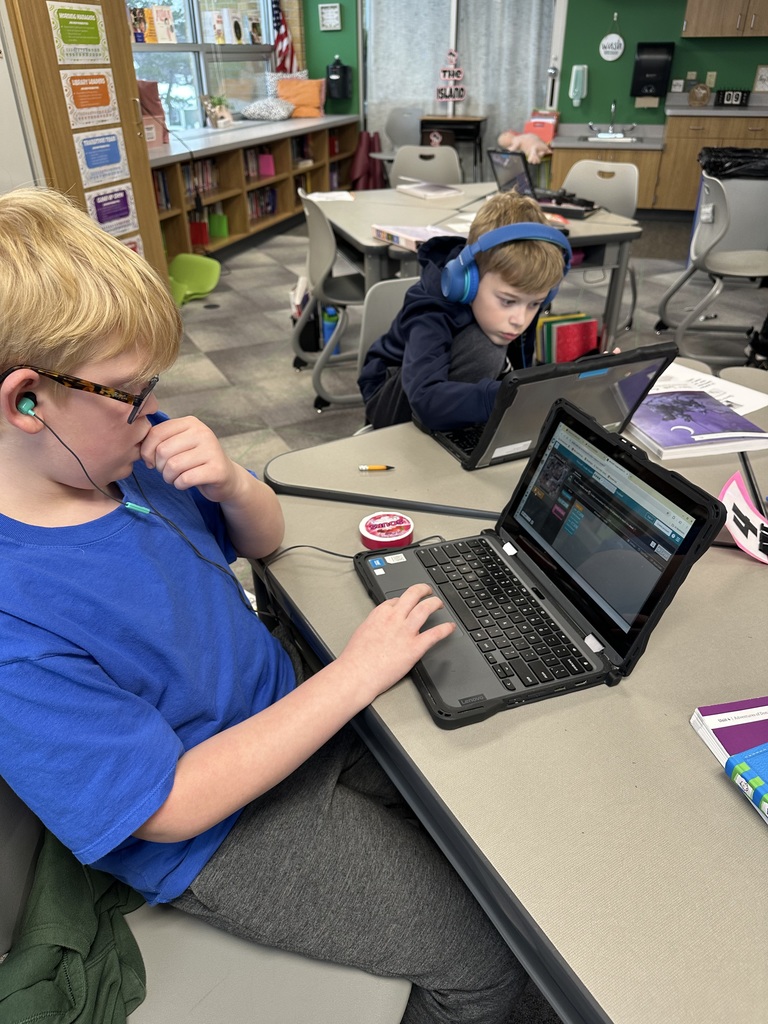 Hour of Code students working at a table
