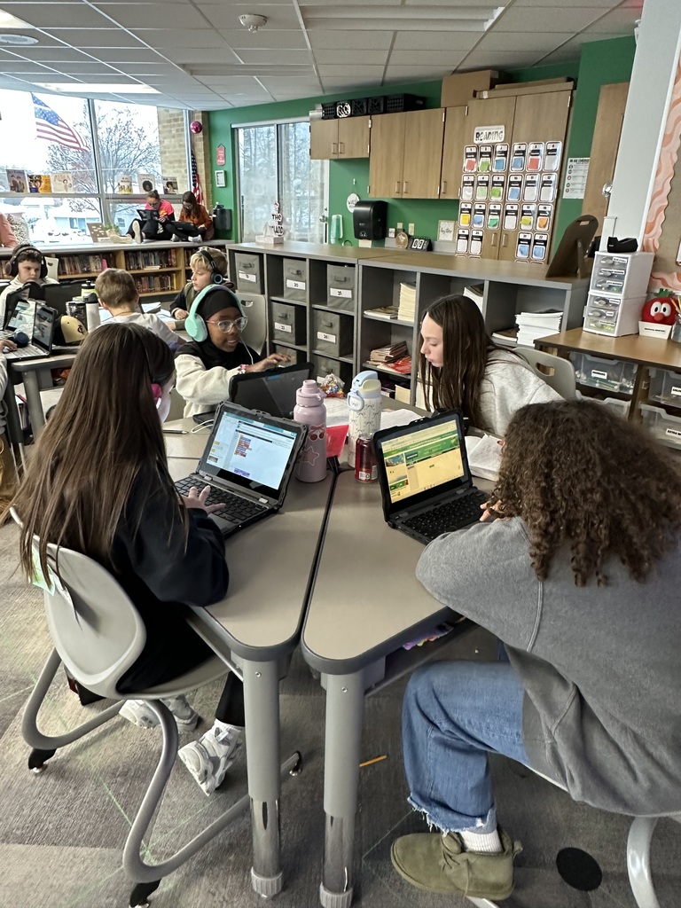 Hour of Code students working at a table
