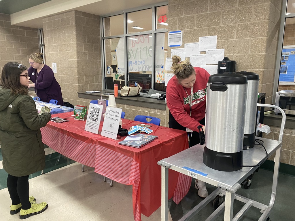 Student awaiting Hot Cocoa for Cure SMA fundraiser