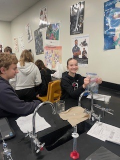 Seventh grade students creating flameless heaters in Science