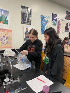 Seventh grade students creating flameless heaters in Science