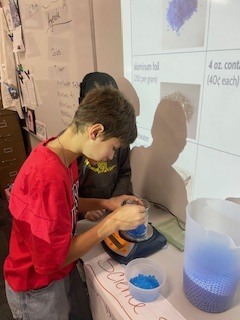 Seventh grade students creating flameless heaters in Science