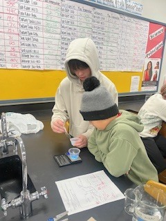 Seventh grade students creating flameless heaters in Science