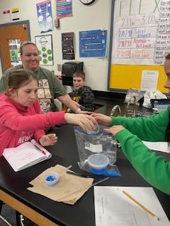 Seventh grade students creating flameless heaters in Science