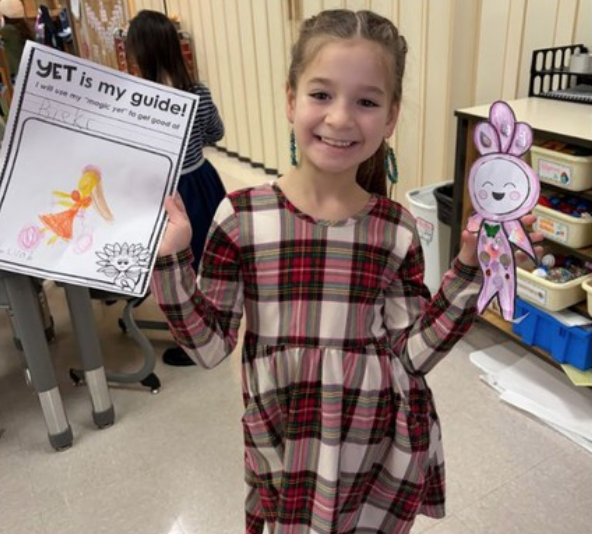 Students Holding Their Work After Learning About Perseverance