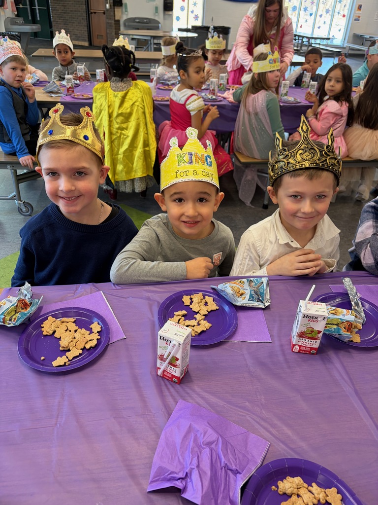 Three smiling boys wearing crowns like kings
