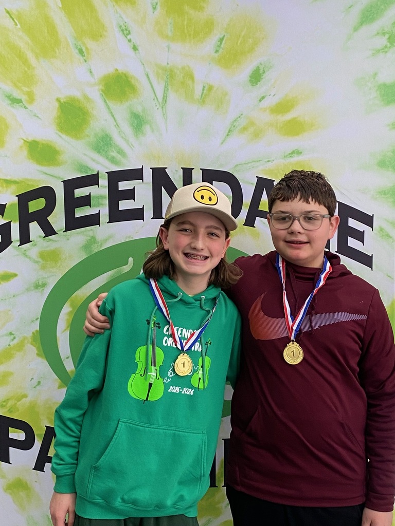 Pair of GMS students posing with their first place medals from GMS Forensics Tournament