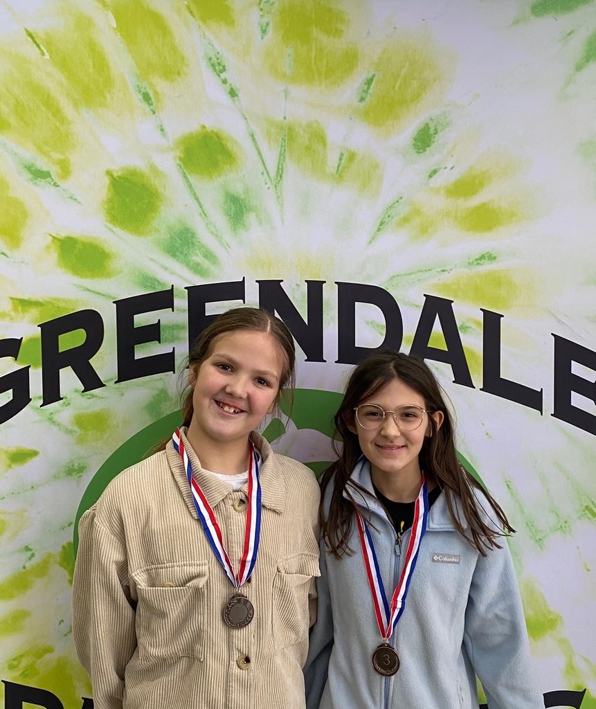 Pair of GMS students posing with their medals from GMS Forensics Tournament