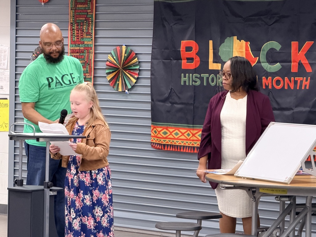 student reading her award winning essay