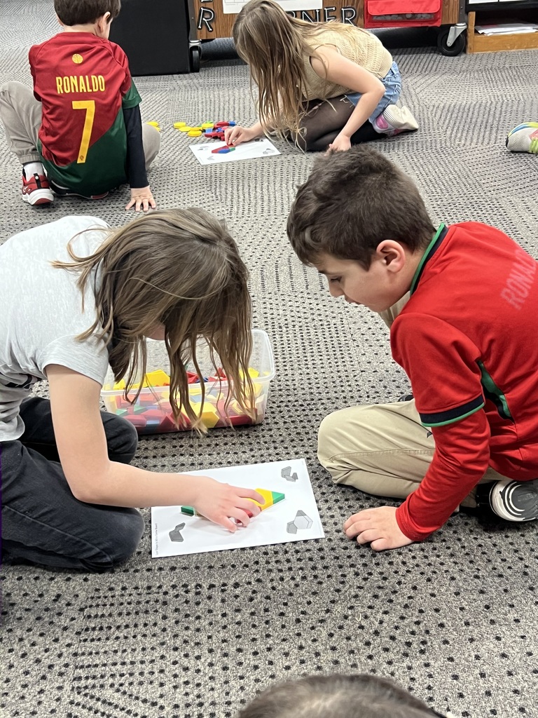 Students cooperating while doing math.