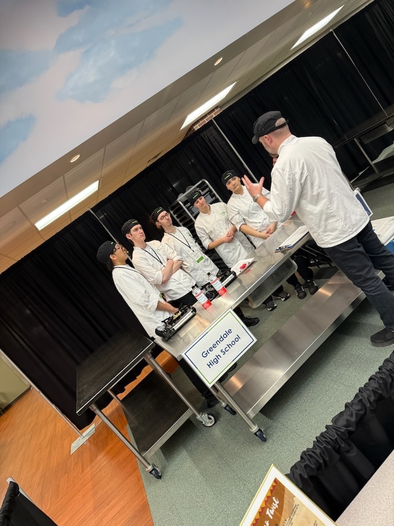 Culinary Team getting instruction at start of competition.
