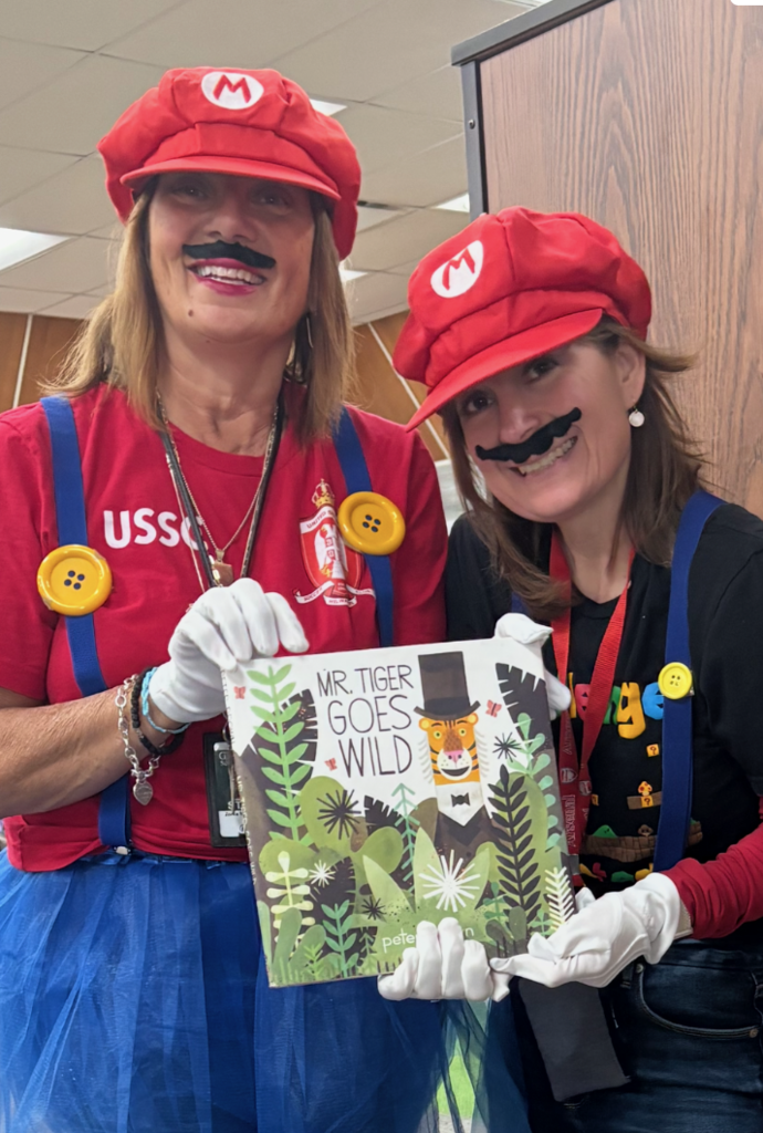 Two teachers dressed like Mario for the Read Across America dress-up day.