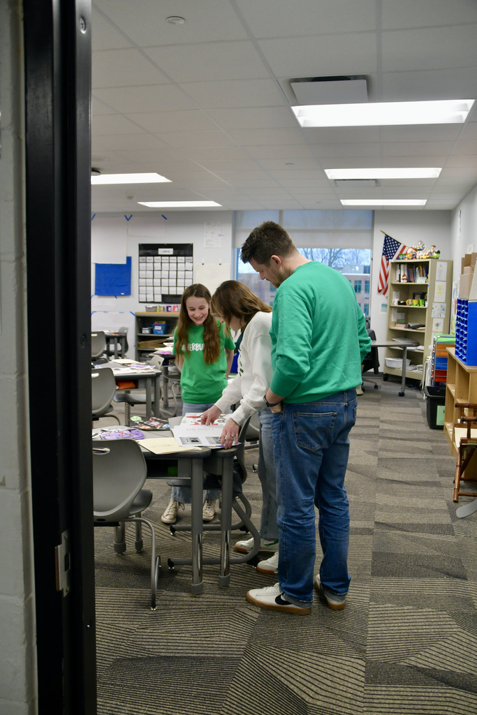 Parents checking out their daughter's classroom work at Jubilee Open House.