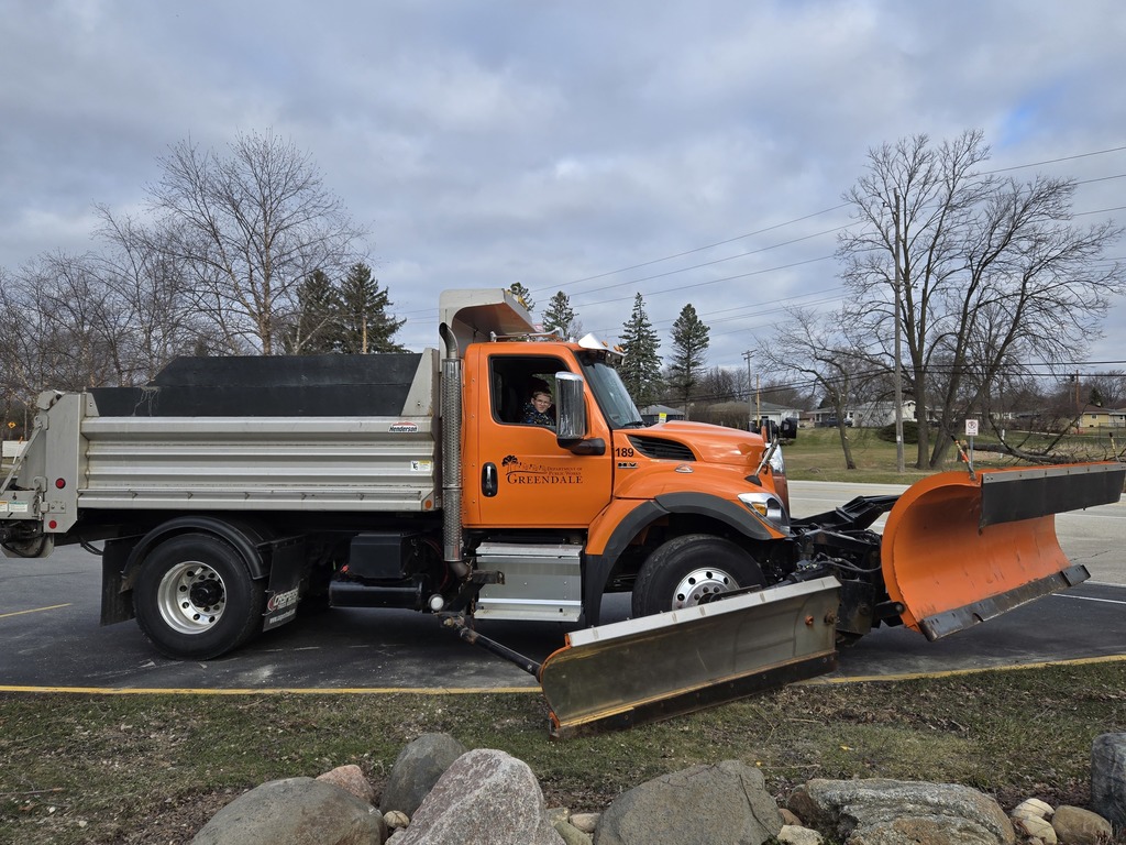Student getting dropped off in a dump truck at College Park.