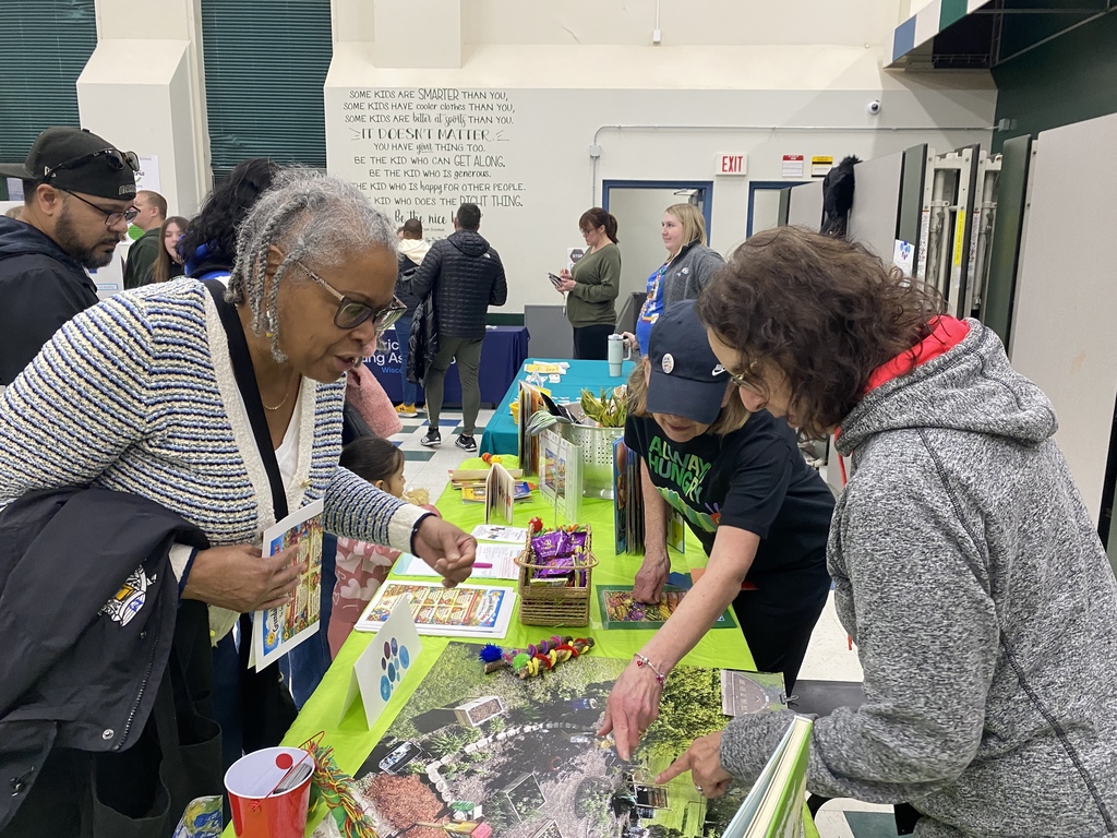 Families at Wellness Event visiting vendor tables.