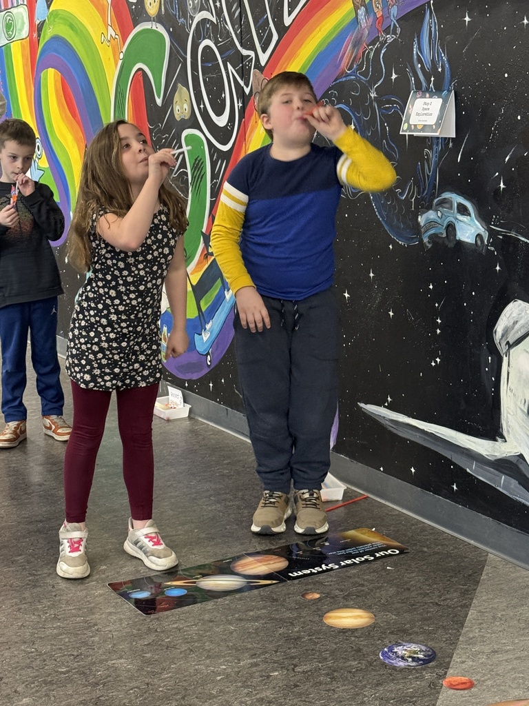 Third graders demonstrating learning on the Solar System.