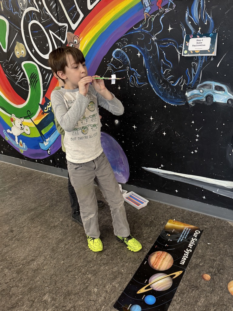 Third grader demonstrating learning on the Solar System.