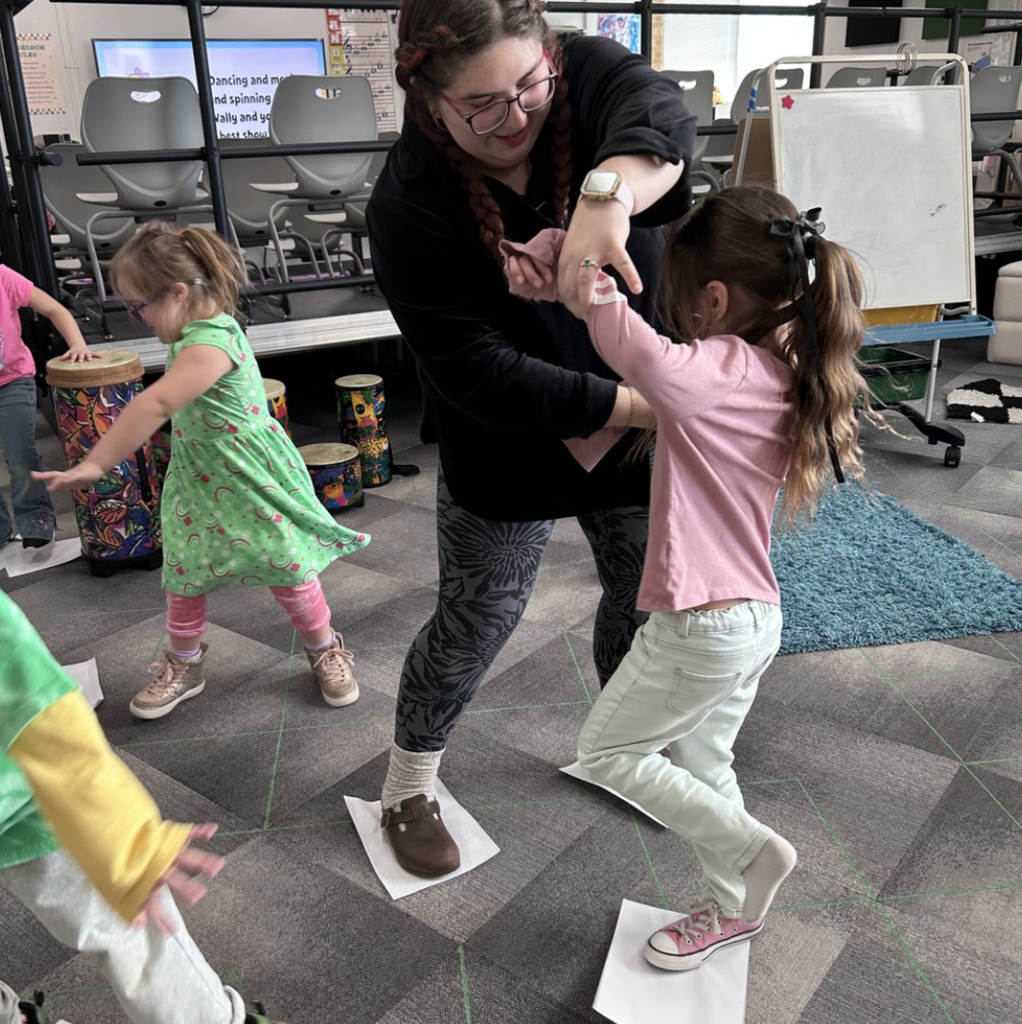 5K students "ice skating" to songs with a Meter of 3 in Music class.