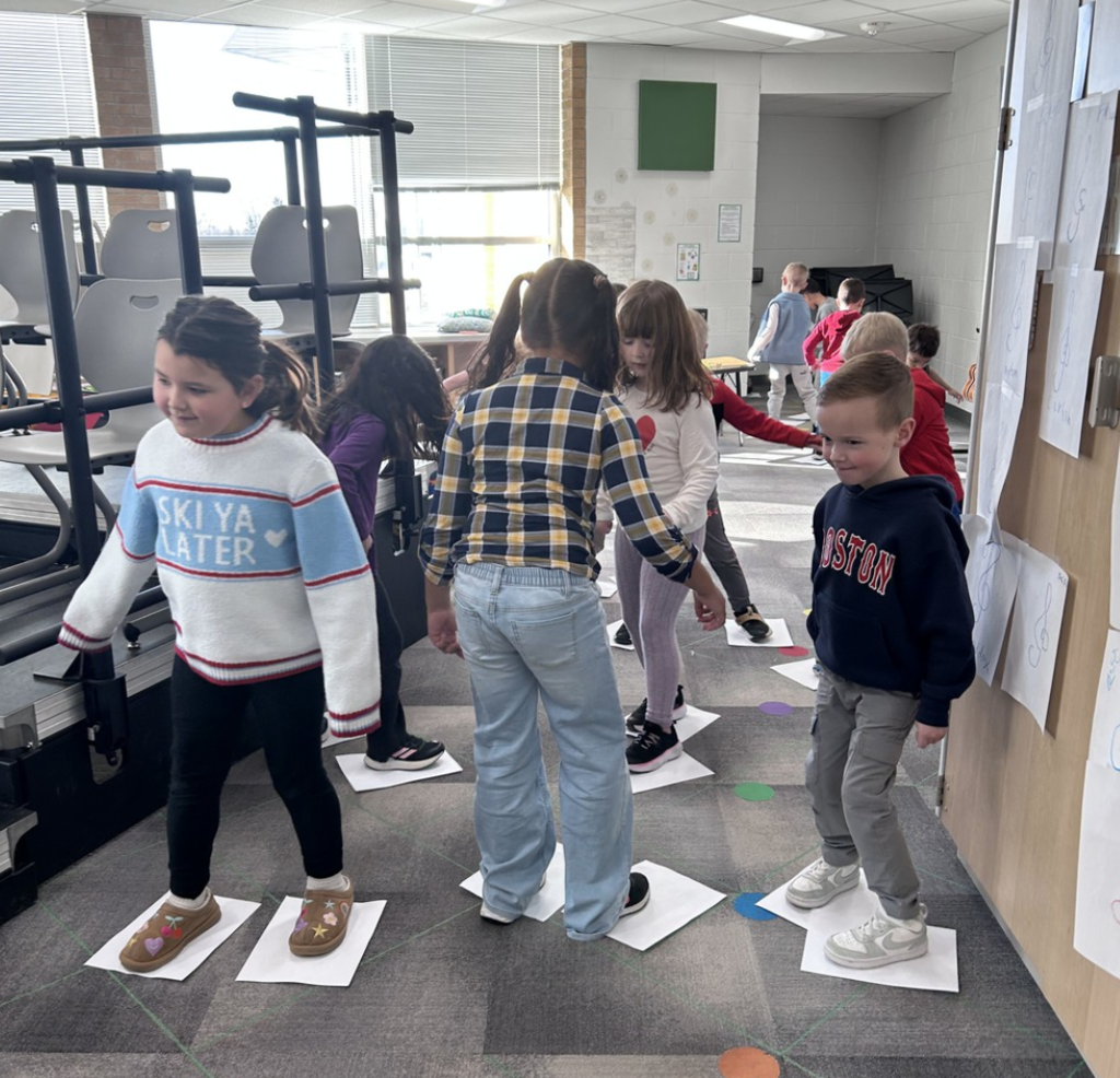 5K students "ice skating" to songs with a Meter of 3 in Music class.