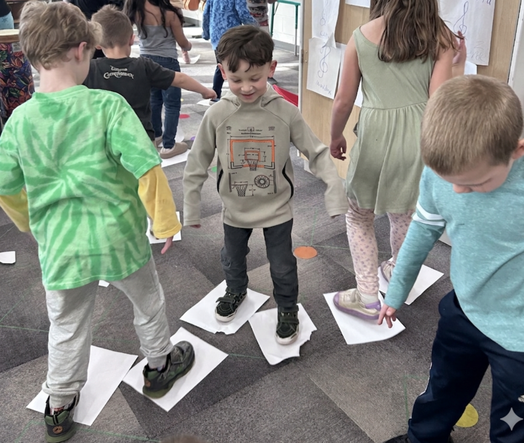 5K students "ice skating" to songs with a Meter of 3 in Music class.