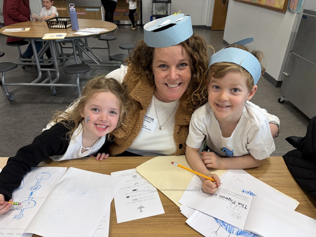 Pigeon Celebration: Mom smiling with arms around two students.