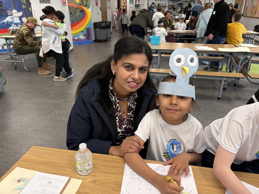 Pigeon Celebration: 5K student posting with a caring adult.