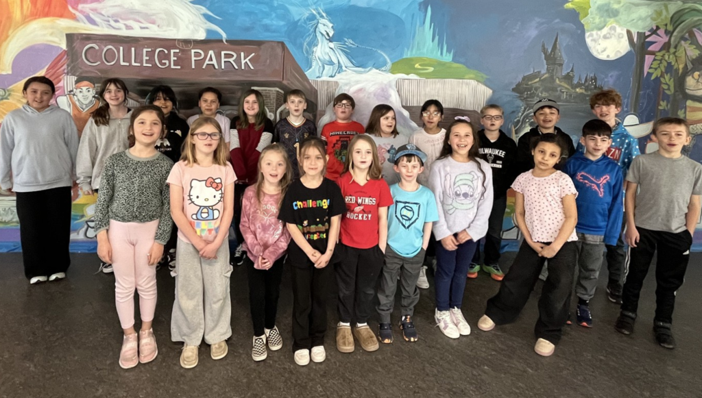 Group photo in front of College Park's mural showcasing Cooperation Award winners.