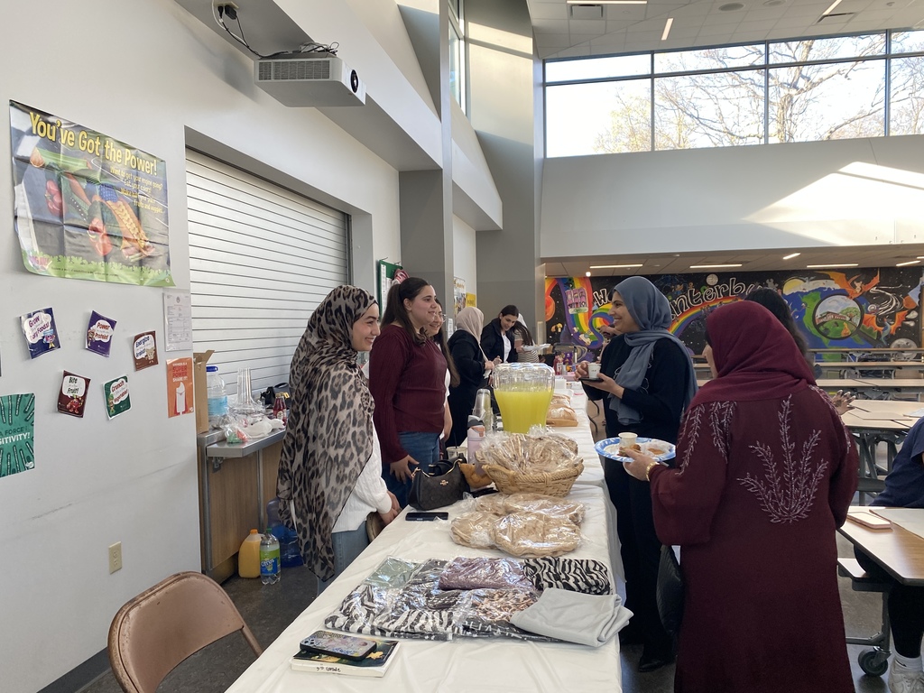 Ladies smiling and enjoying shopping for Bread and scarves