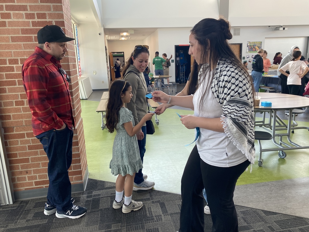 Children and adults receiving door prize ticket