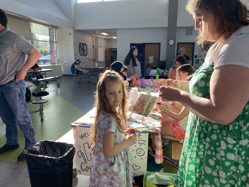 Young child working on crafts at special event.