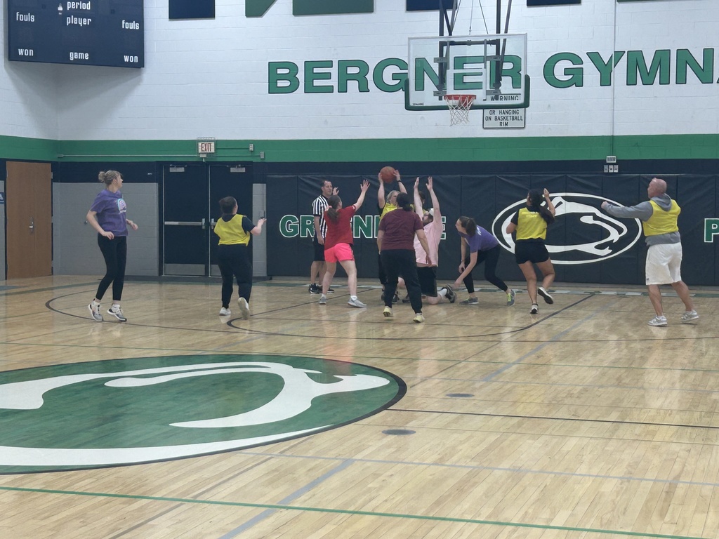 Staff playing basketball as a reward for students' efforts in pb&j drive/cooperation.