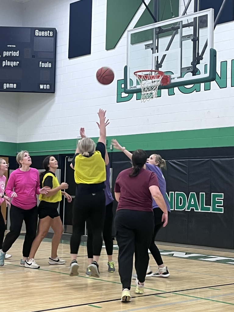 Staff playing basketball as a reward for students' efforts in pb&j drive/cooperation.