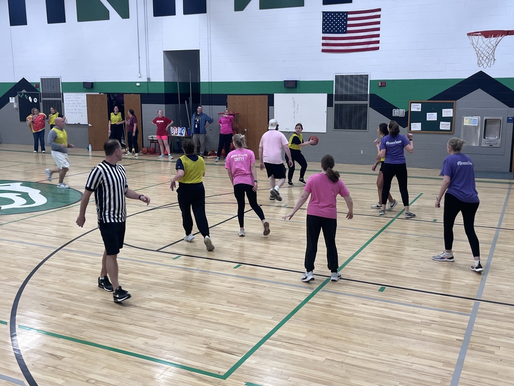 Staff playing basketball as a reward for students' efforts in pb&j drive/cooperation.