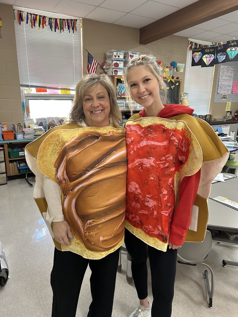 Teachers posing in peanut butter and jelly costumes.