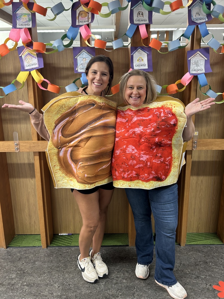 Teachers posing in peanut butter and jelly costumes.