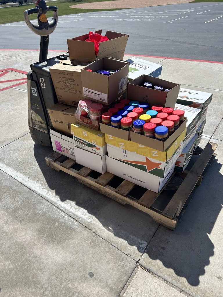 Boxes of peanut butter and jelly collected in the school drive.