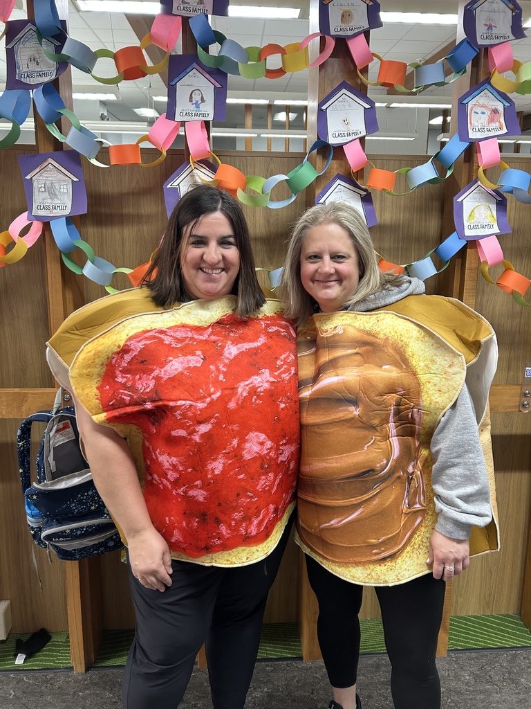 Teachers posing in peanut butter and jelly costumes.