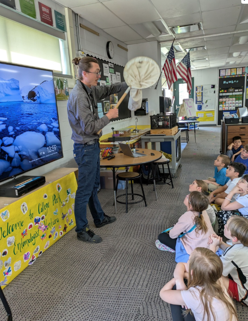 Second graders listening to Entomologist, Martin Ventura, as he presented info about insects.