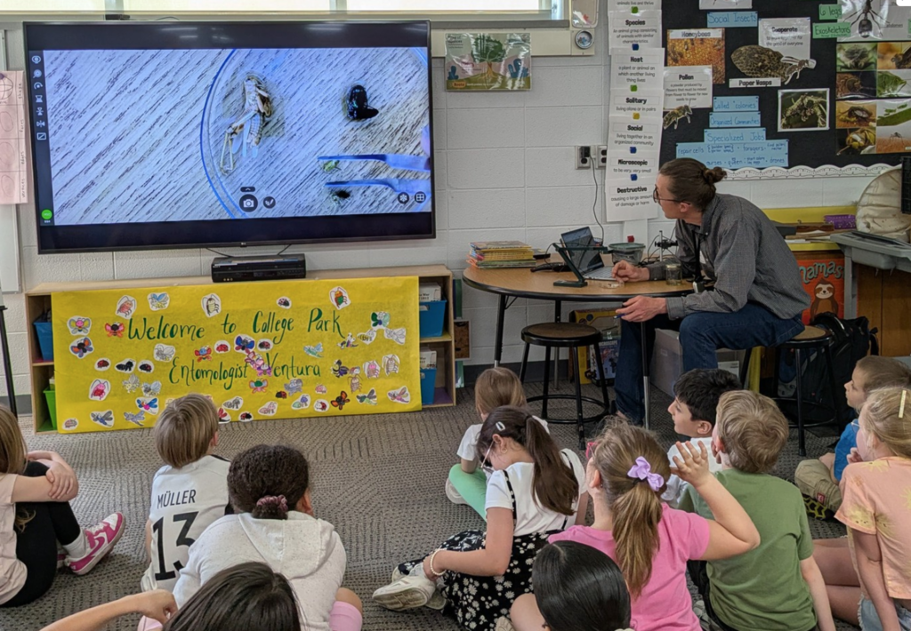Second graders listening to Entomologist, Martin Ventura, as he presented info about insects.