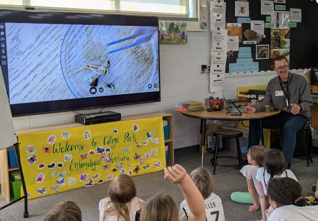 Second graders asking Entomologist, Martin Ventura, questions about insects.
